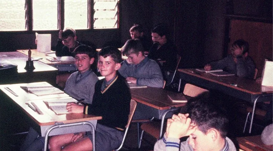 A heritage photo of students sitting at their desks working at Mazenod College Perth WA.