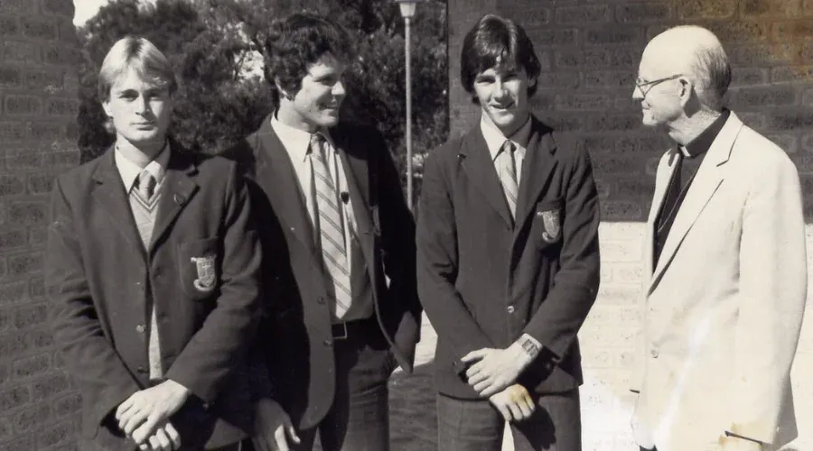 A heritage photo of students chatting with an oblate at Mazenod College Perth WA.